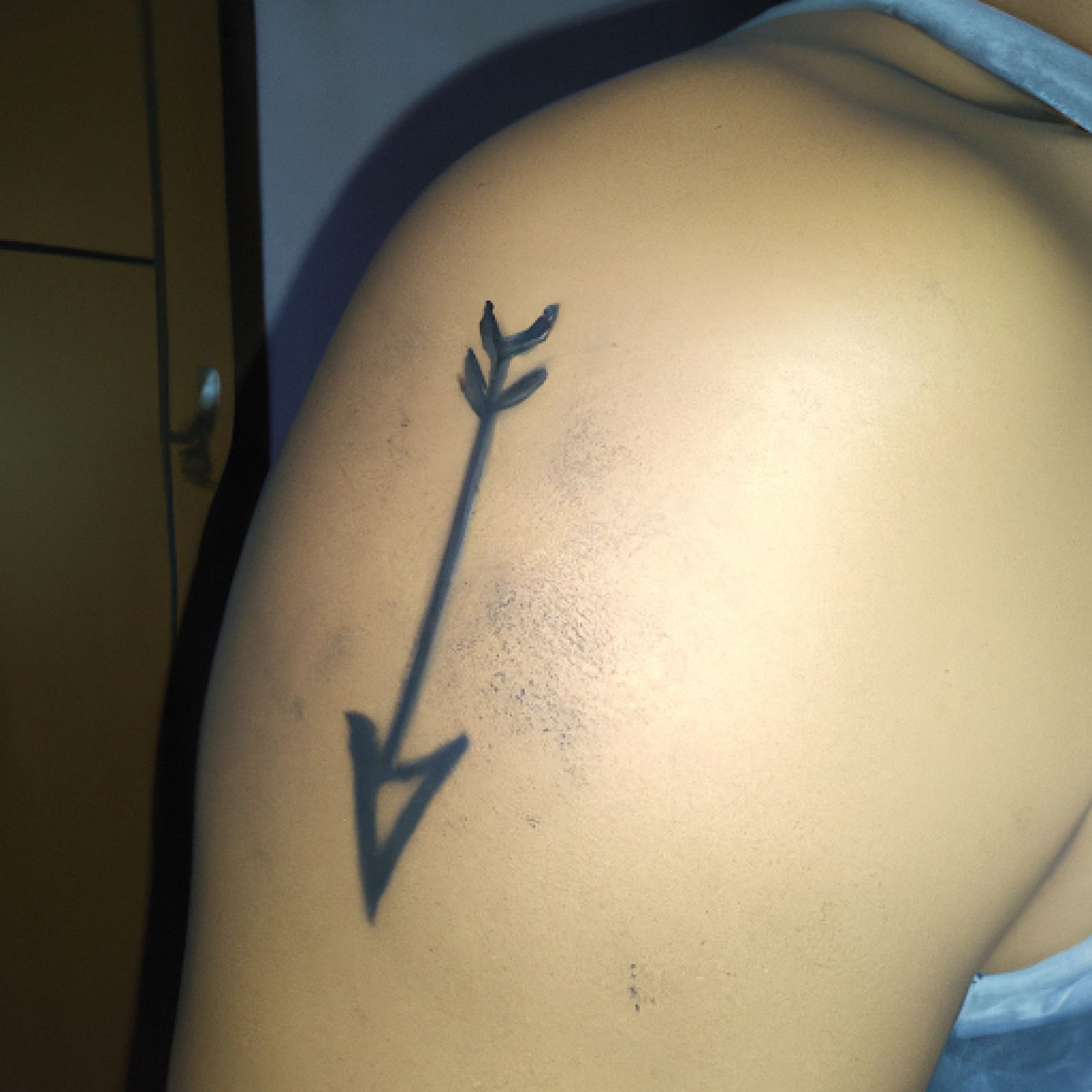 Arrow tattoo on chest for men