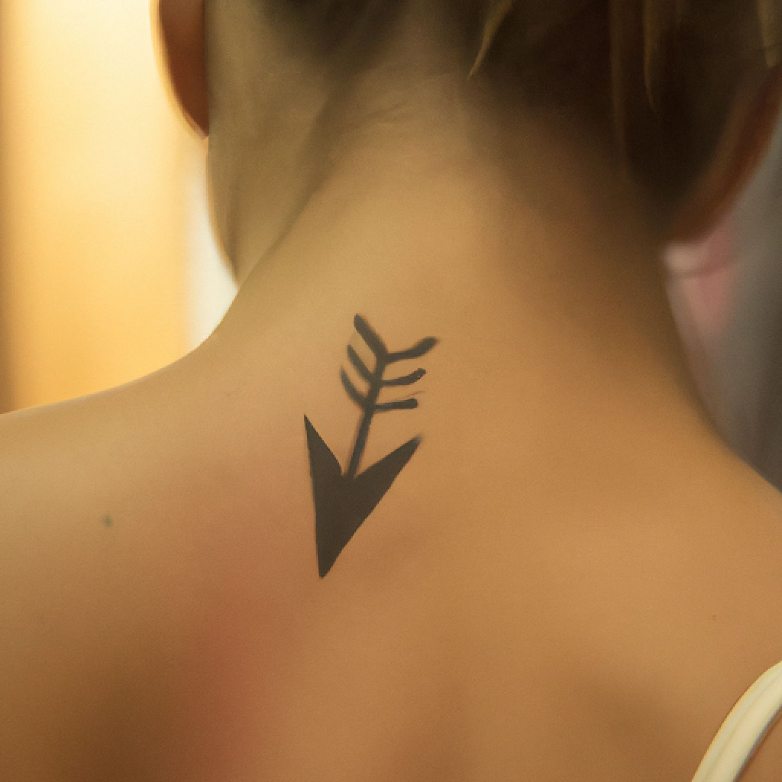 Arrow tattoo on shoulder for women