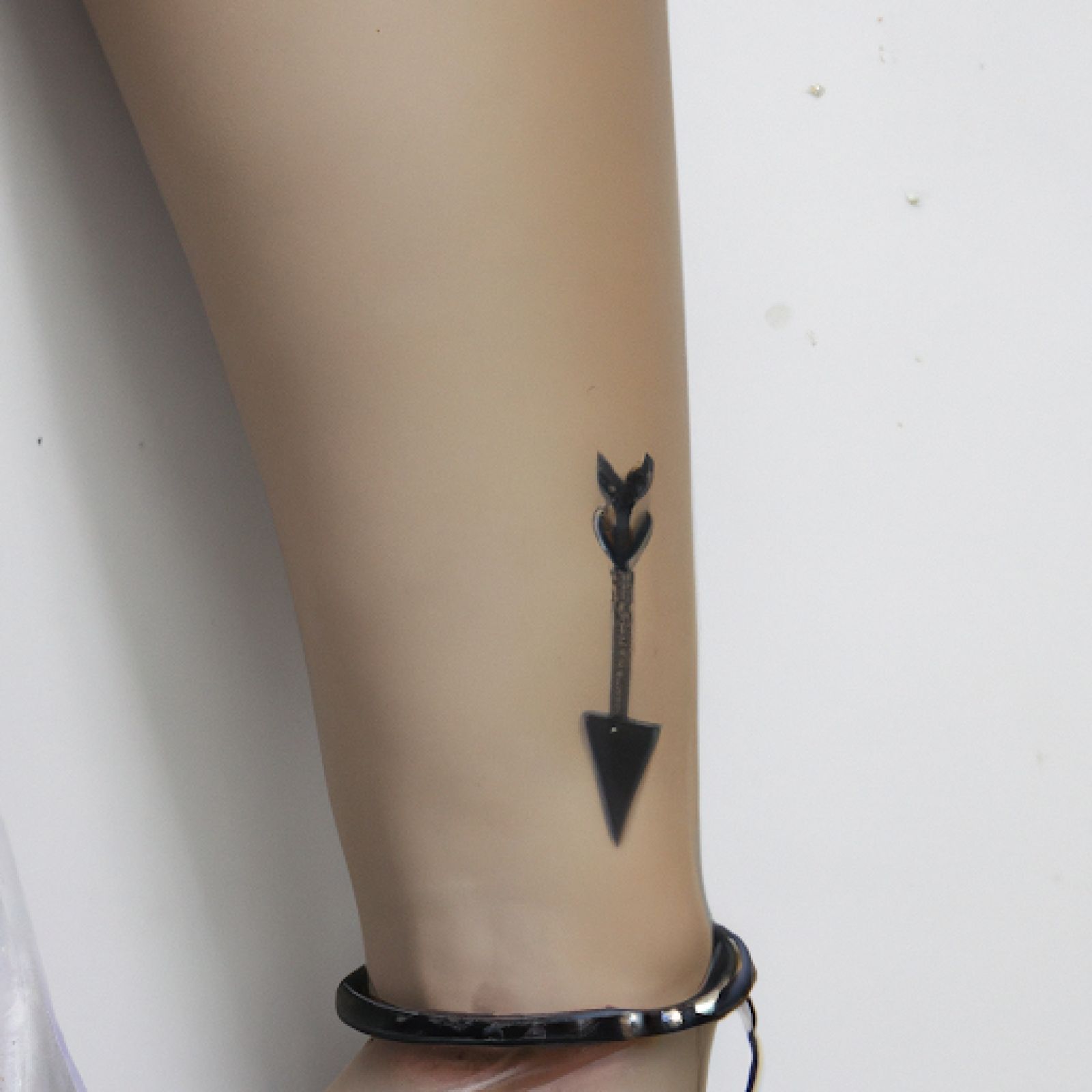 Arrow tattoo on wrist for women