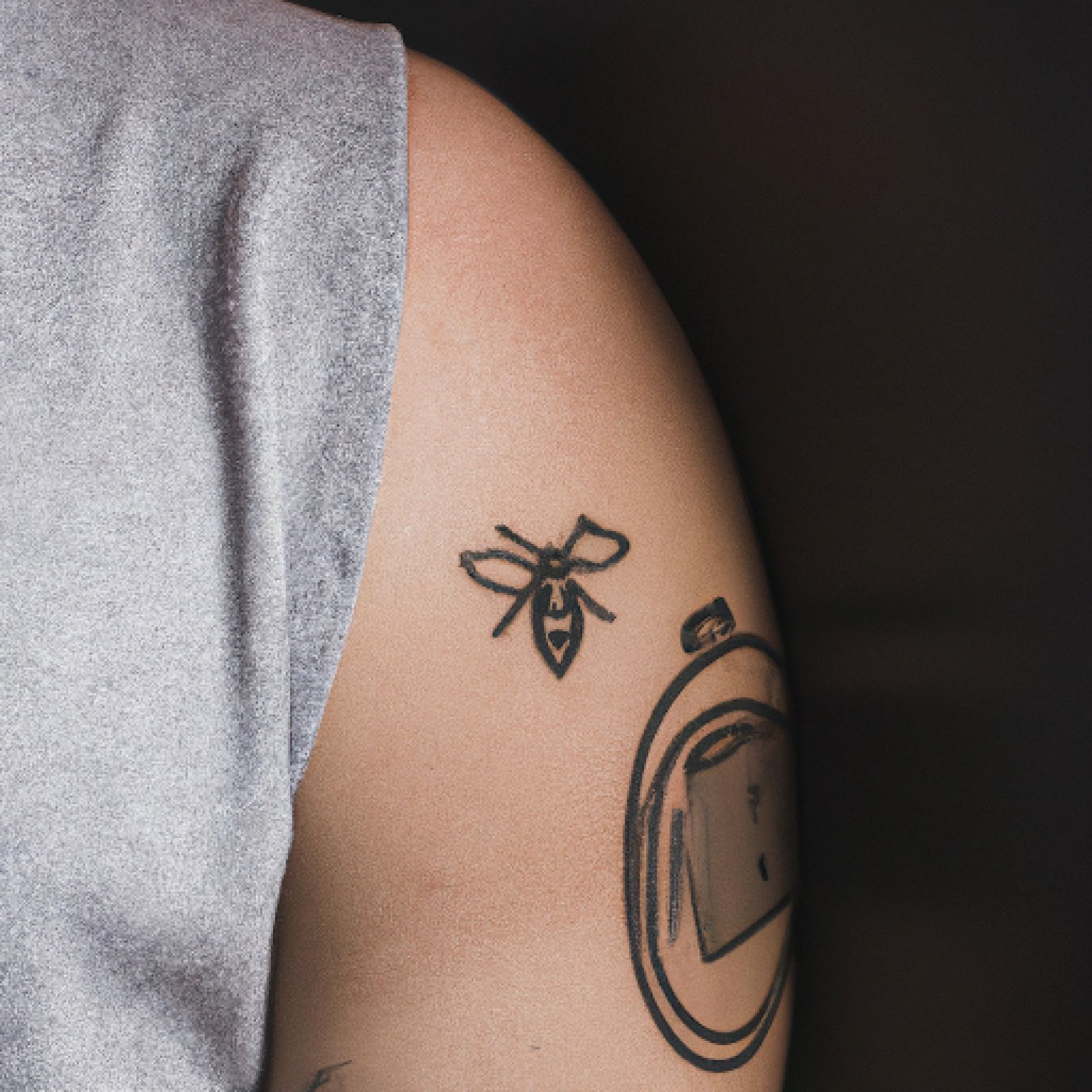 Bee tattoo on chest for men