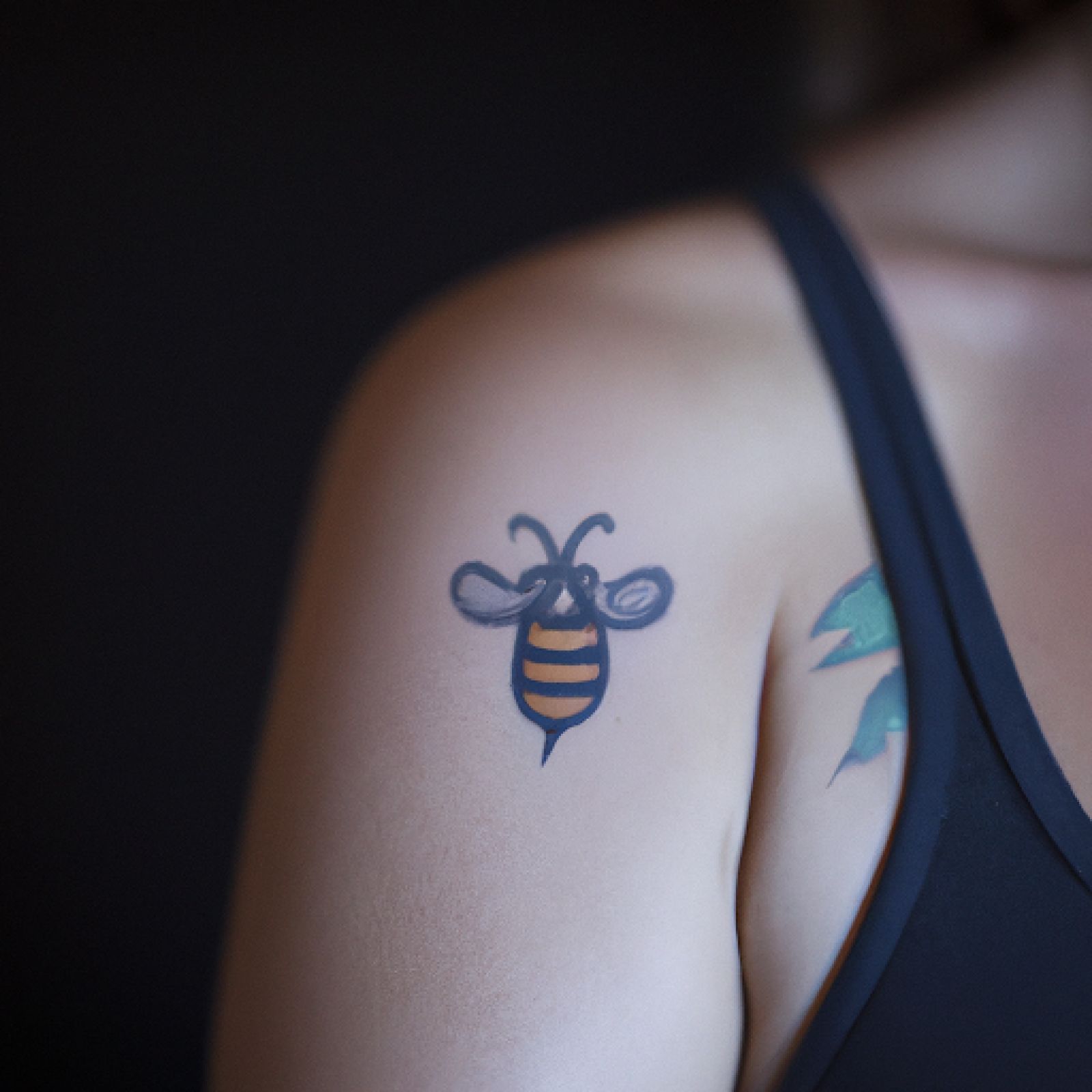 Bee tattoo on chest for women