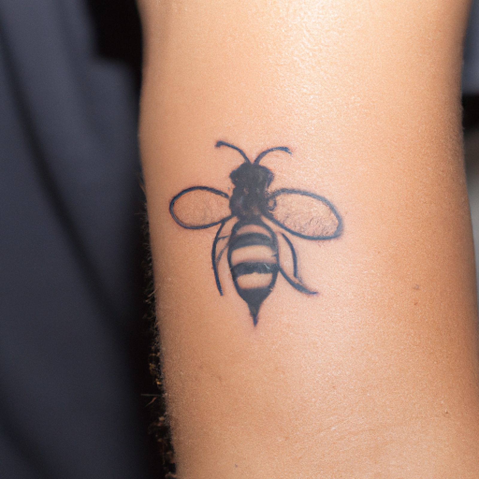 Bee tattoo on forearm for men