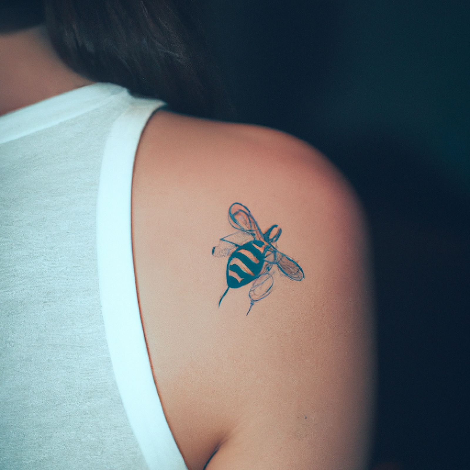 Bee tattoo on shoulder for women