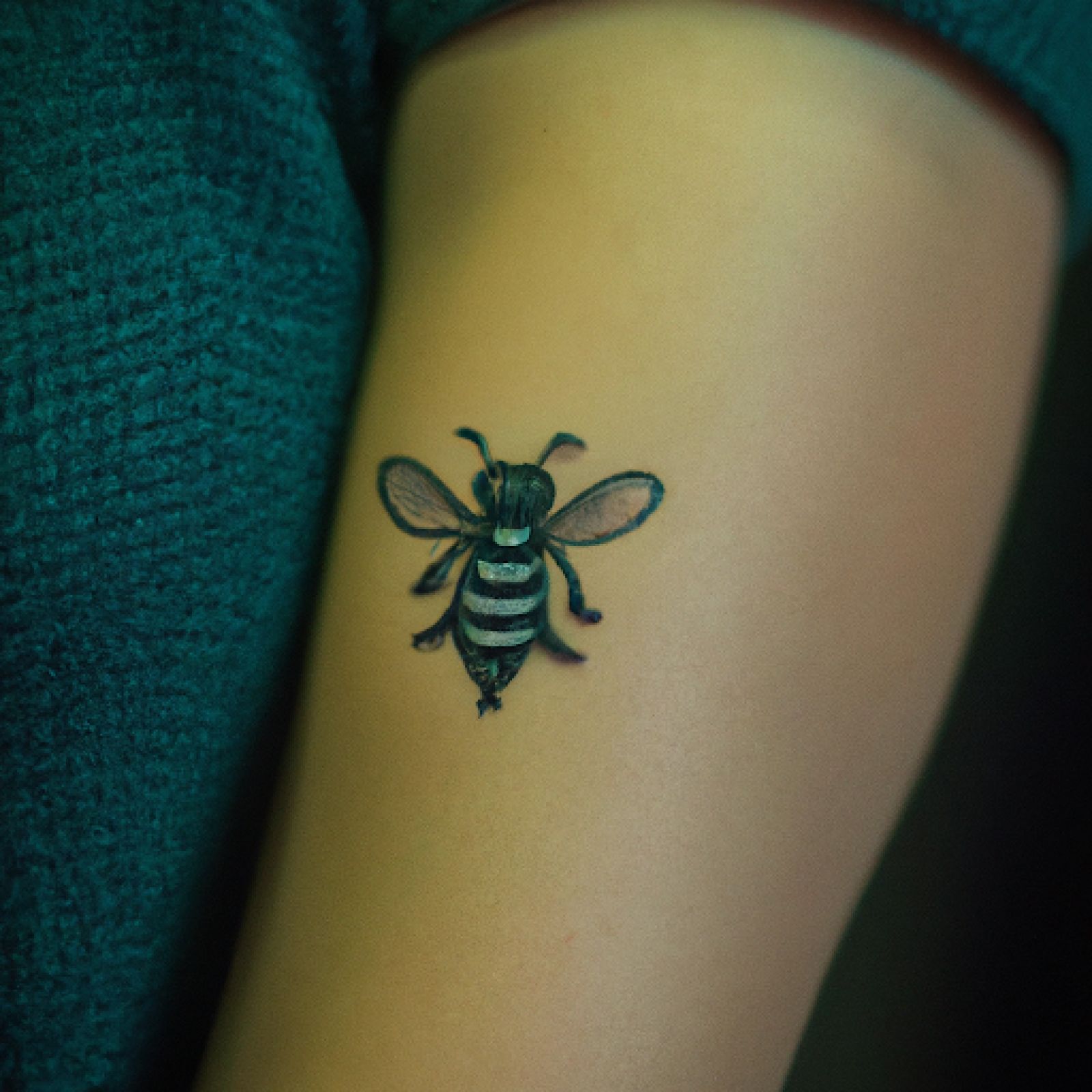 Bee tattoo on sleeve for women