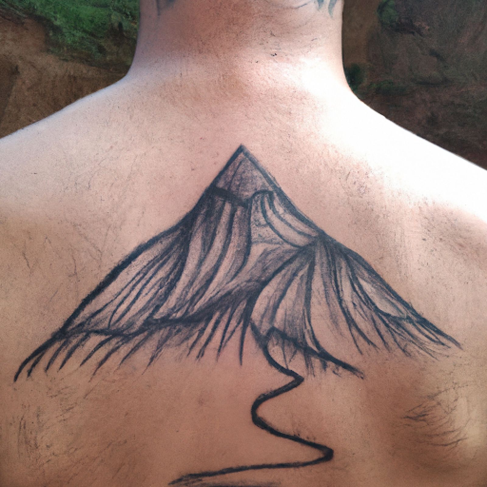 Mountain tattoo on back for men