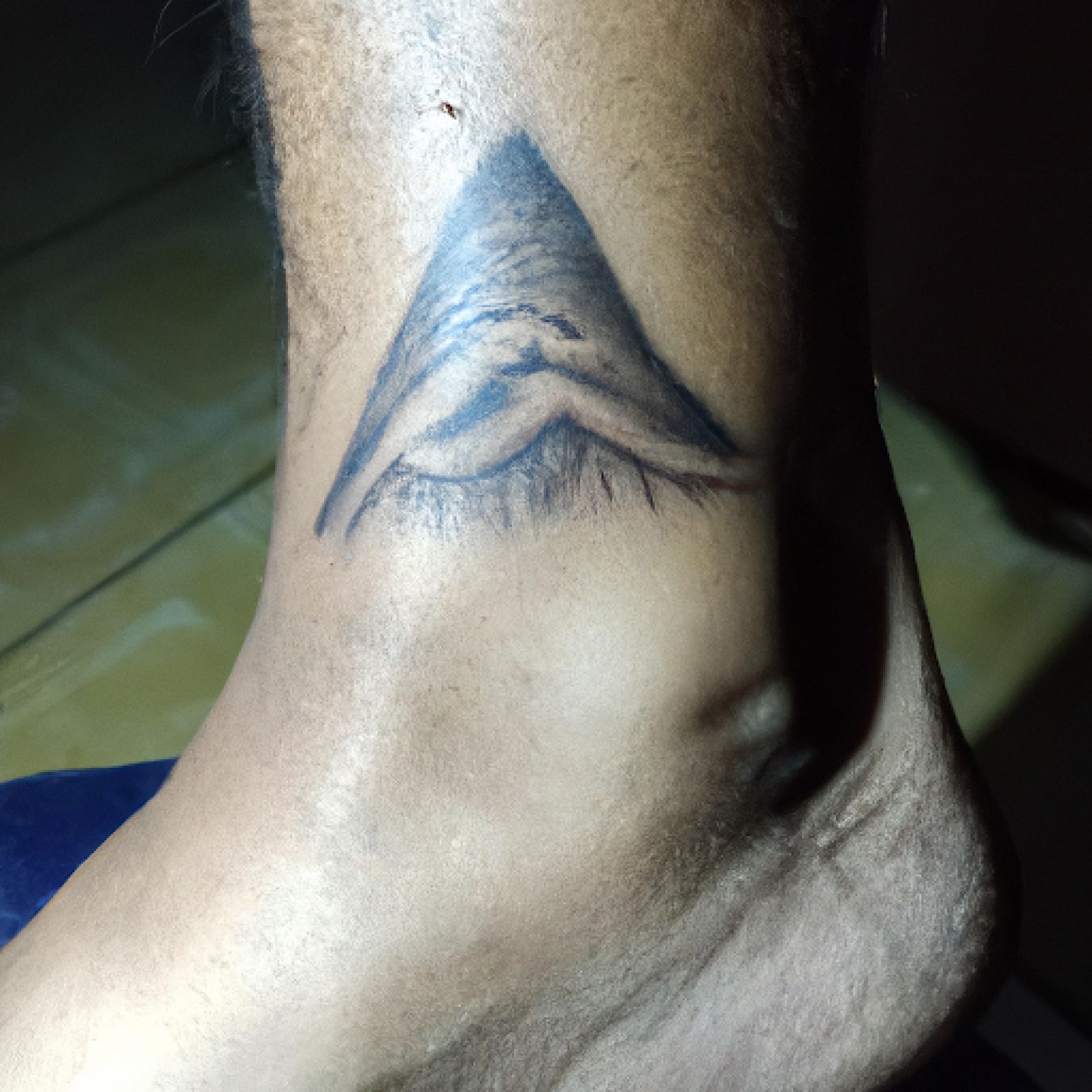 Mountain tattoo on foot for men