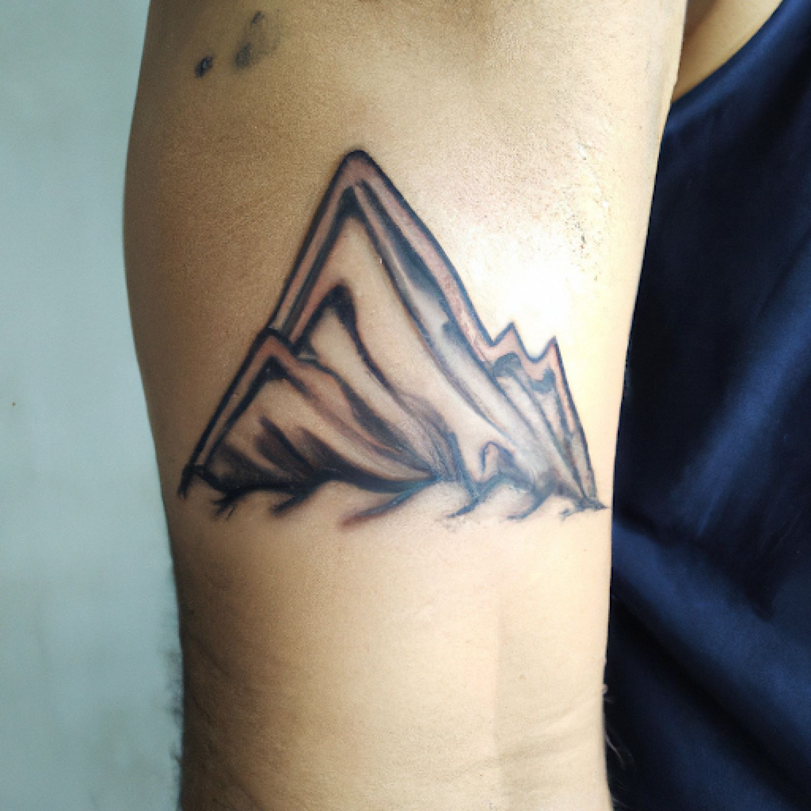 Mountain tattoo on forearm for men